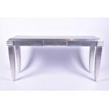 An Art Deco style side table attributed to Andrew Martin with tapering squared legs above stepped