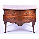 A 20th century French Louis XV style commode of bombe form, the shaped marble top above a set of two