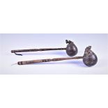 An unusual pair of South Asian treen covered ladles each with turned handles and globular bowls, one