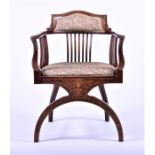 An Edwardian mahogany and inlaid Glastonbury chair with shaped back over slatted rail and drop-in