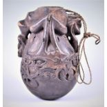 An early 20th century or earlier carved medicine flask, possibly Lupong Iban (Borneo) believed to be