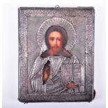 An early 20th century Russian silver mounted icon the silver oklad with 84 kokoshnik mark, and