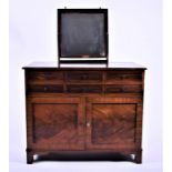 A 19th century mahogany side or dressing table with raising mirror back, six short drawers over a