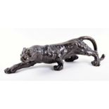 A cast bronze study of a leopard realistically modelled in the Barye style, 62 cm wide.
