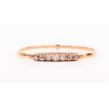 A Russian diamond hinged bangle the central detachable motif with tongue clasp to each side, set