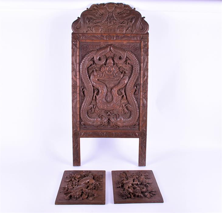 A pair of early 20th century well carved continental oak panels and a carved Chinese panel the
