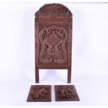 A pair of early 20th century well carved continental oak panels and a carved Chinese panel the