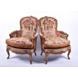 A pair of 19th century style French salon chairs with needlework upholstery depicting figures in