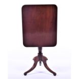 A Georgian mahogany tilt-top side table  on a turned column with swept tripod base, 66 cm x 52 cm