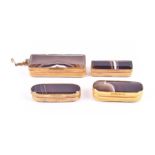 A small collection of 19th century banded agate vesta cases each with ormolu engine turned or