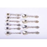 A collection of late 18th century French and German silver teaspoons each with pierced and c