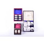 An Edwardian boxed set of six napkin rings Chester 1906, by E J Trevitt and Sons, together with a