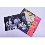 Rolling Stones: Love You Live LP, fully signed with accompanying photo of the band signing the LP.
