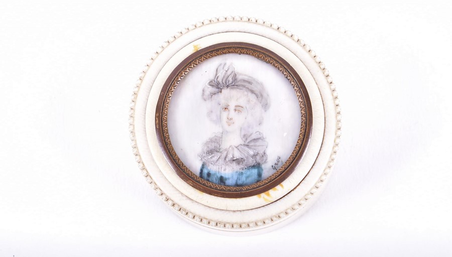 A 19th century ivory circular box the lid mounted with a miniature of a young lady. Signed 'Gros'. 3