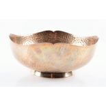 A Mexican silver bowl, with retail mark for Cartier the semi-globular body with undulating rim,