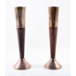 A pair of Cartier mid century candlesticks of tapering form, the silver mounts in a stylish plain