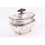 An Edwardian silver tea caddy Sheffield 1908 by Mark Wallis & Sons, the body of oval form with