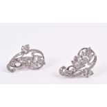 A pair of diamond floral spray earrings the white metal mounts set with various round-cut