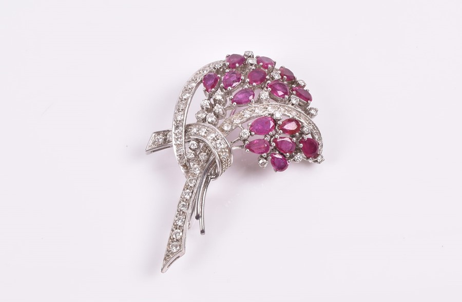 An 18ct white, diamond, and ruby brooch in a floral bouquet, set with pear-cut rubies and round - Image 3 of 3