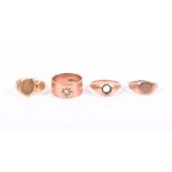 A group of four assorted rings including a 9ct rose gold signet ring, a yellow gold signet ring, a