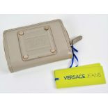 Versace Jeans purse in mushroom the outer patent body is applied with the Versace Jeans logo, the