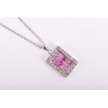 A 14ct white gold, diamond, and pink sapphire pendant calibre-set to centre with square-cut