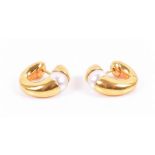 A pair of  Italian 18ct yellow gold and pearl earrings of hinged clip form, stem backs, 11.6 grams.