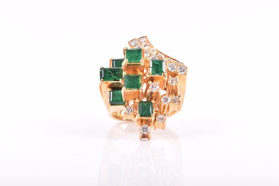 An unusual 14ct yellow gold, diamond, and emerald cocktail ring in the Modernist taste, the uneven