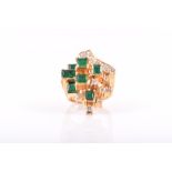 An unusual 14ct yellow gold, diamond, and emerald cocktail ring in the Modernist taste, the uneven