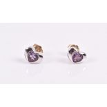 A pair of 18ct white gold and amethyst earrings the heart-shaped mounts set with a round-cut