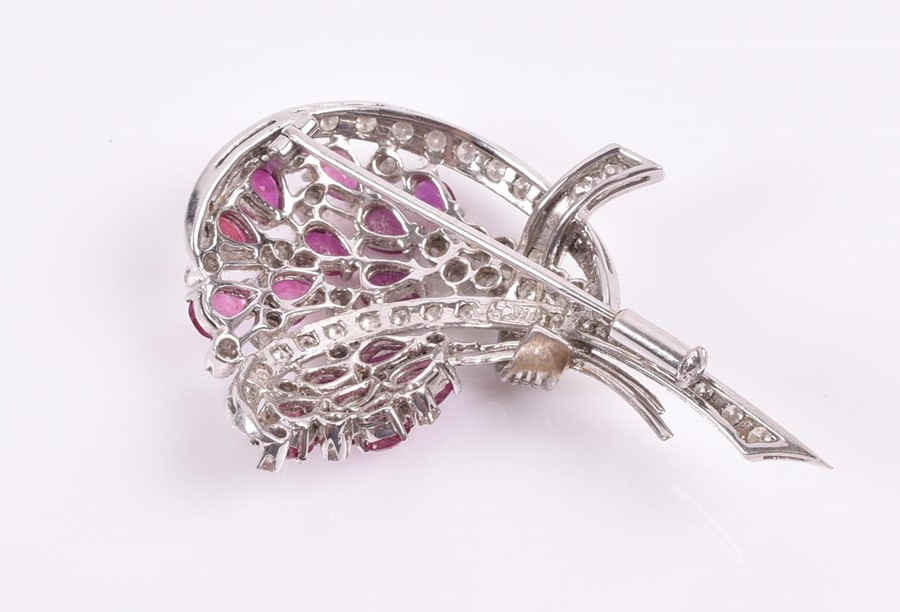 An 18ct white, diamond, and ruby brooch in a floral bouquet, set with pear-cut rubies and round - Image 2 of 3