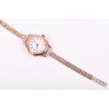 A 9ct yellow gold ladies wristwatch with enamel Arabic numeral dial, on 9ct gold strap, 23 grams.