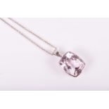 A white gold and kunzite pendant set with a rectangular cushion-cut pale pink kunzite of