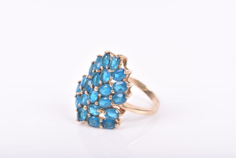 A 9ct yellow gold and peacock apatite ring set with a stylised cluster of mixed oval-cut blue - Image 2 of 3