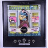 A large Elvis Presley illuminated wall radio the front with a central panel depicting Elvis in