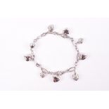 A 9ct white gold bracelet suspended with eight heart-shaped charms, each alternating charm pavé-