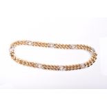 Theo Fennell. An 18ct yellow gold and diamond choker / necklace with flattened curb links, with