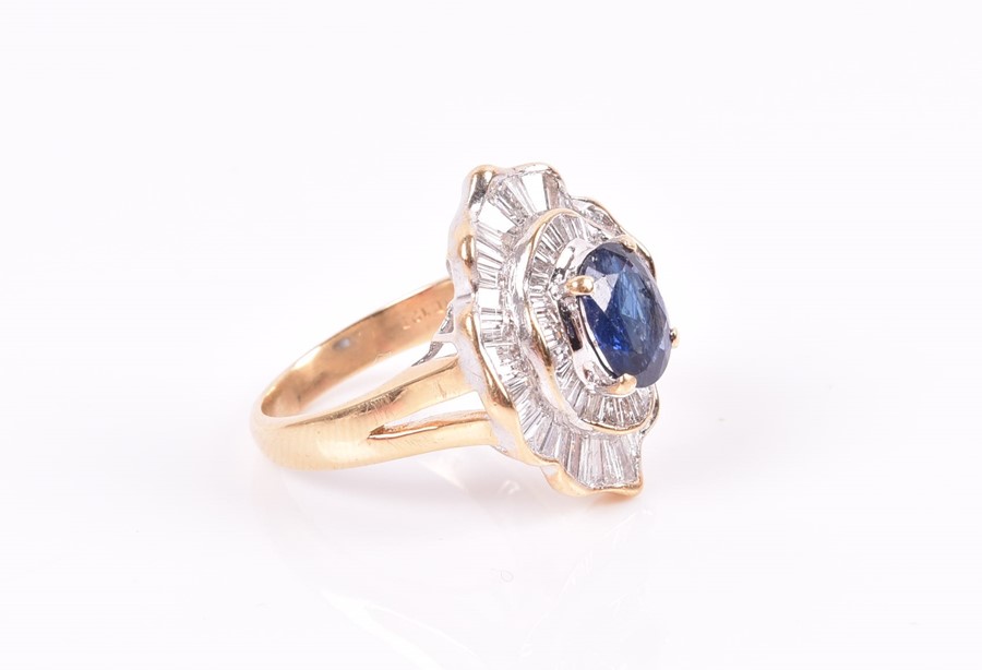 An 18ct yellow gold, diamond, and sapphire ring set with an oval-cut sapphire, within two double - Image 3 of 3