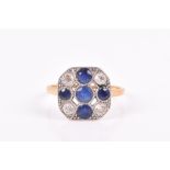 An 18ct yellow gold, diamond, and sapphire cluster ring the openwork square chamfered mount inset