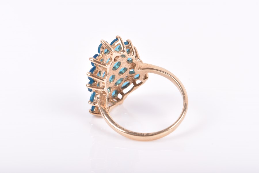 A 9ct yellow gold and peacock apatite ring set with a stylised cluster of mixed oval-cut blue - Image 3 of 3