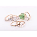 A group of six 9ct gold yellow gold rings set with assorted gemstones, including a cultured pearl,