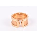 Cartier. An 18ct yellow gold C de Cartier ring with brushed effect mount, engraved 2000, Cartier,