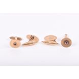 Two pairs of 9ct gold cufflinks one with engraved crests and fluted bars, the other of circular form