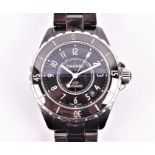 A Chanel J12 black steel and ceramic automatic wristwatch the black dial with white numerals, and