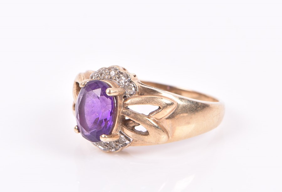 A 9ct yellow gold, diamond, and amethyst ring set with a mixed oval-cut amethyst with openwork - Image 3 of 3