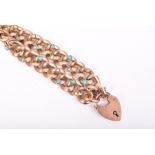 An antique 9ct yellow gold, turquoise and pearl bracelet set with padlock clasp. 13 grams.