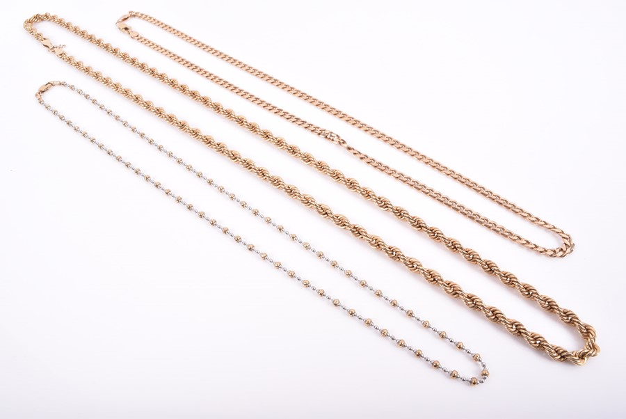 A group of three 9ct yellow gold necklaces of beaded, rope twist and curb link designs. 36 grams. (