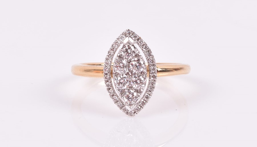 An 18ct yellow gold and diamond cluster ring the navette-shaped cluster and halo mount set with