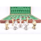 A cased cast silver and silver gilt chess set in the Staunton pattern, within a wooden case with a