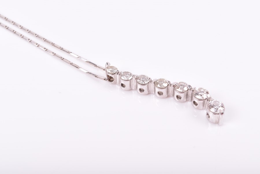 A white gold and diamond pendant set with seven round-brilliant cut diamonds, mounted in a - Image 3 of 3